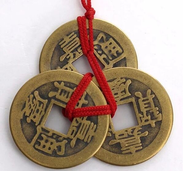 Coins with red thread for success